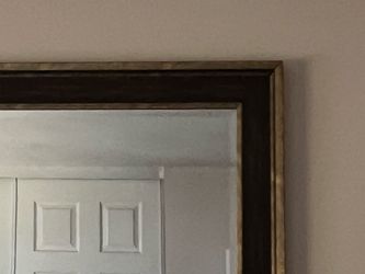 Large mirror with gold detail. 67” x 37”.