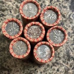 One Roll Of Wheat Pennies With An Exposed Steely