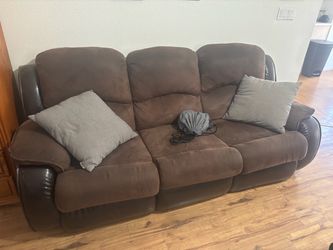 Two matching couches well used
