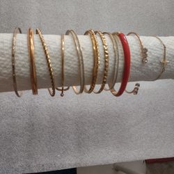12 gold-tone bracelets, different styles, all for one price, excellent condition