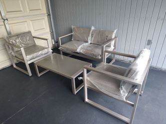 Outdoor patio loveseat with chairs and coffee table