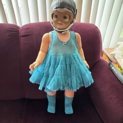 Cute vintage doll wearing a dress