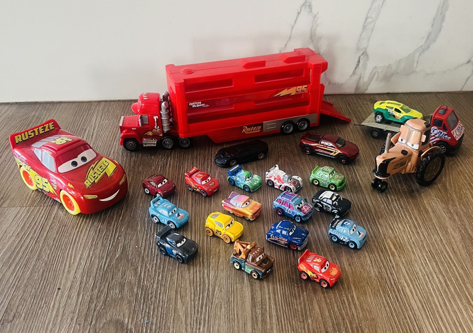 Disney Pixar Cars Mack Mini Racers Hauler and a collection of various mini racer vehicles