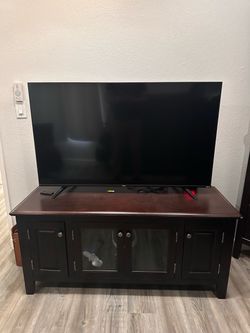 55” TLC Tv plus 4-door cabinet Tv stand Combo