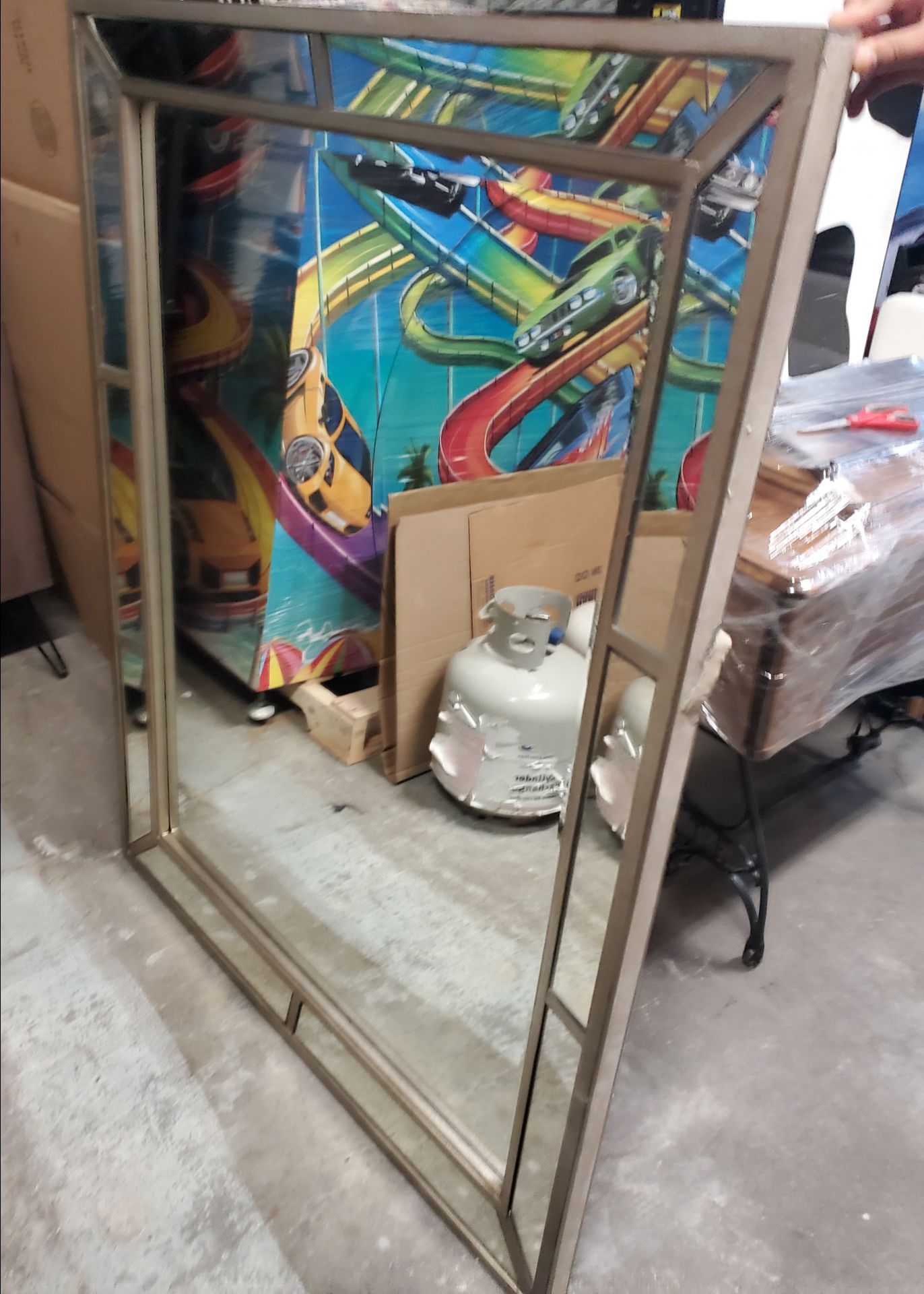large silver-toned metal framed mirror