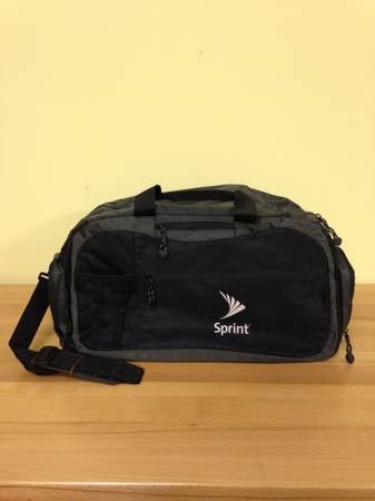 New! Black Duffel bag. Soft sided, flexible carry bag with strap.