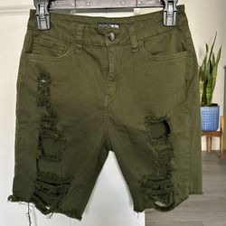 Fashion Nova distressed twill shorts in a military green color