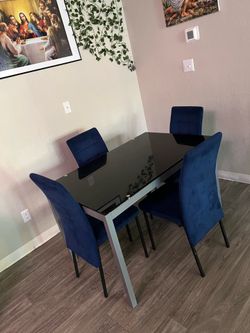 small glass dining table with chairs