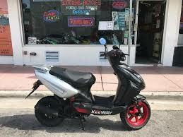 Photo W.T.b. A Moped Or Scooter