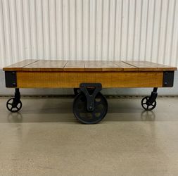 Rustic reclaimed wood w/ cast iron wheel coffee table