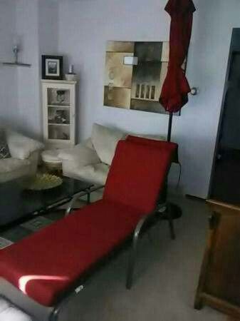 Lounger chair w/cushion and umbrella w/stand! Like New!