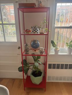 Tall red shelving unit