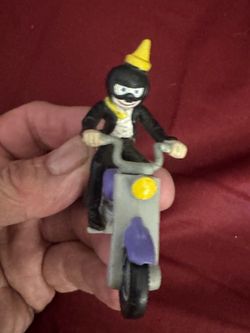 Vintage Toy Figure on Motorcycle Jack in the box