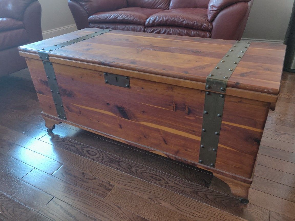 Vintage/antique Cedar chest with brass studs and wheels.