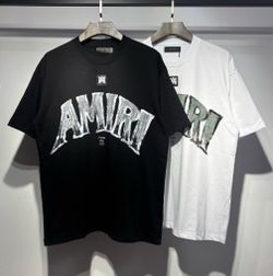 Black or white amiri shirt in medium packaged