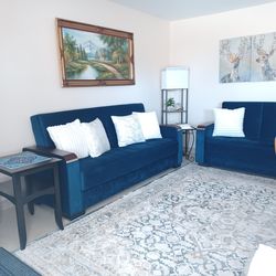 Royal Blue velvet sofa, loveseat, 8 by 10 carpet, floor lamp,3 small tables, and the wall oil  painting