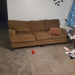 couch and loveseat with ottoman