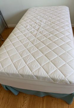 Twin bed and mattress.