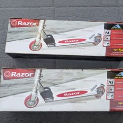 2 New In Box Razor scooter Aluminum folds up and Urethane wheels