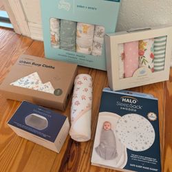 Swaddles, blankets, baby sleep sack, and sound making machine- all Brand new, never opened.