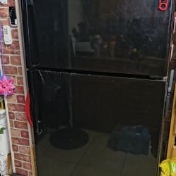 Black  Refrigerator. Some Plastic Still On