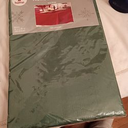 Brand new tablecloth and two pairs of fabric napkins green from Kmart firm price pick up only $12 bucks pick up only 865 Ellsworth avenue right off of
