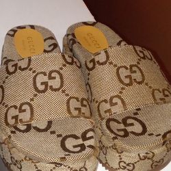 Gucci Sandals, Louis Vuitton Wallet, Versace Sunglasses.