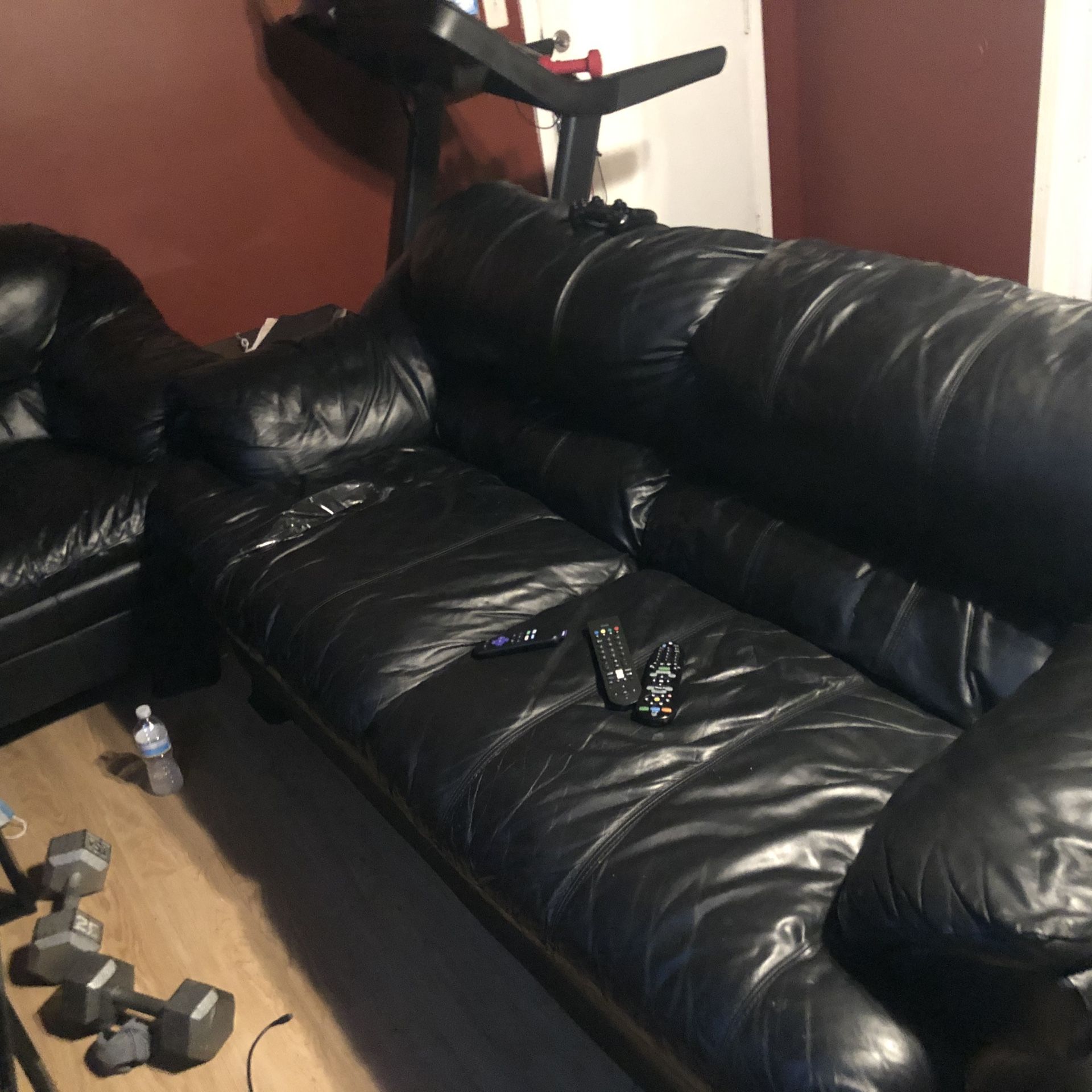 Black genuine leather sofa and love seat