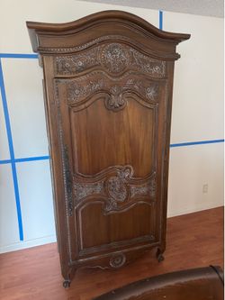French Provincial Carved Wood Armoire
