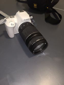 Canon EOS rebel sl2 white camera with lens extender