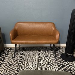 Brown faux leather loveseat