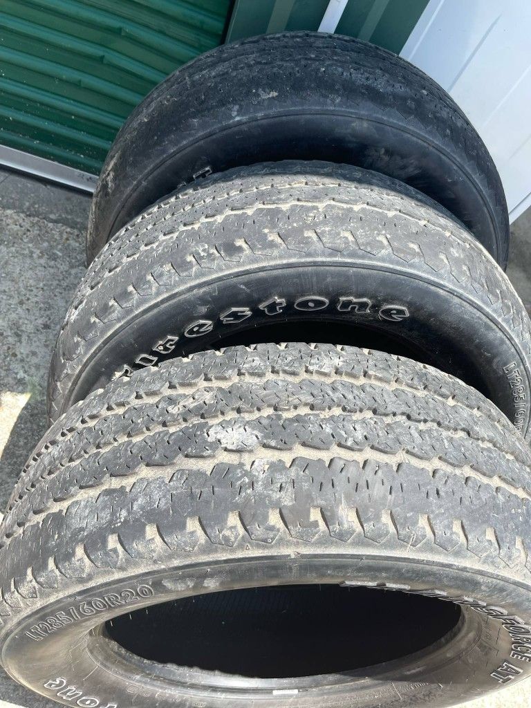 Three Firestone LT 285/60/20 tires