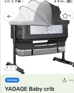 Fancy baby bassinet- like new
