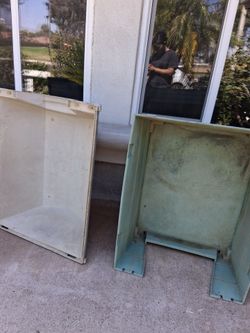 Green and red plastic dog houses