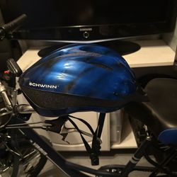 This is a Schwinn adult bicycle helmet in blue.   a Dial Fit adjustment system for a custom fit.  The helmet has 10 contoured ven