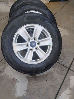 Ford F-150 tires New. w OEM rims