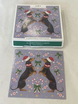 Pack of Christmas cards featuring dachshund illustrations by Catherine Rowe. 16 cards & envelopes