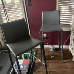 Two Gray Leather Bar Chairs