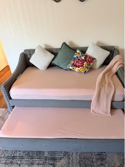 Gray sofa-rolling bed with mattress