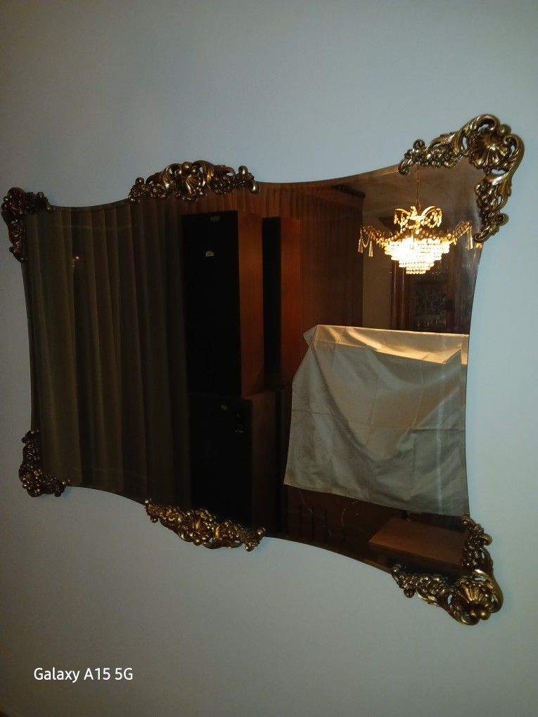 Antique Wall Mirror With Gold Decerations At Four Corners