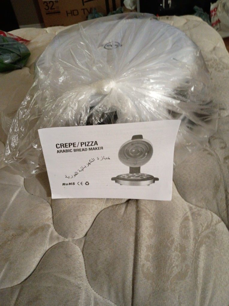 White 12 Inch Pizza Maker And You Can Also Make Cookies ,Pancakes,And Quesadillas