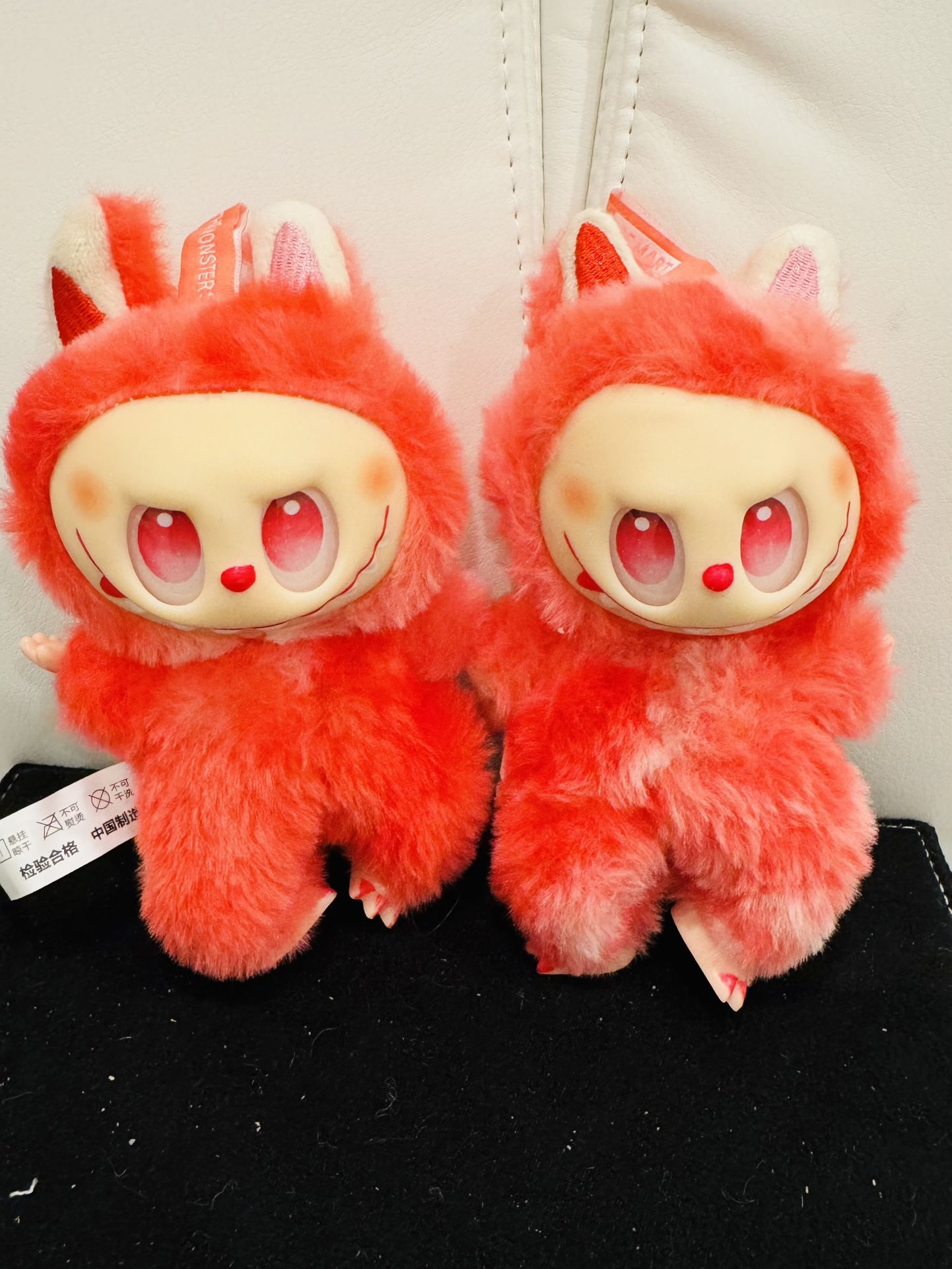 Two Hot Pink Monster Plushy’s Together
