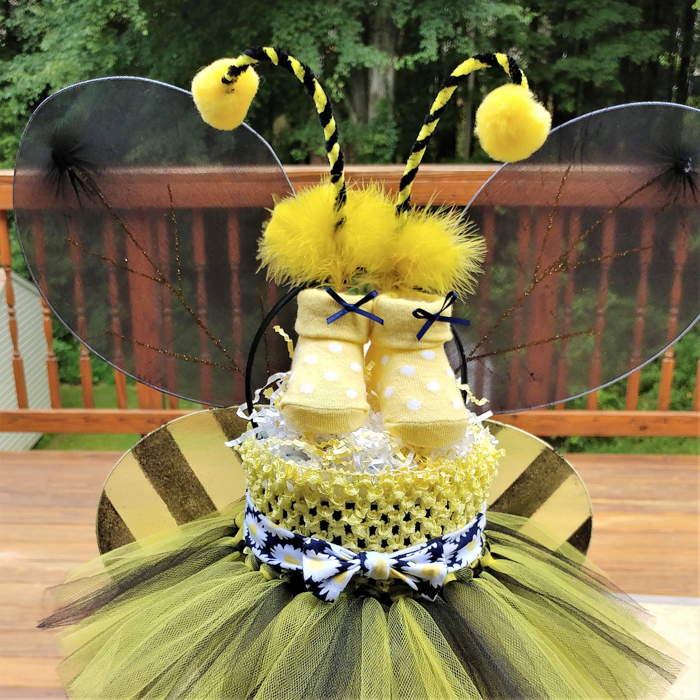 Bumble Bee Diaper Cake- This is an adorable three tier yellow and black cake.
