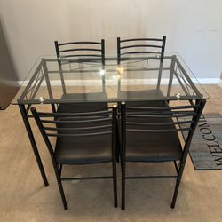 Glass dinning table and chairs