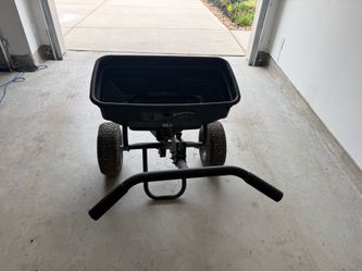 Seed and fertilizer spreader
