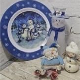Plastic snowman family plate, tall clear resin snowman, fabric snowman, and small resin snowman