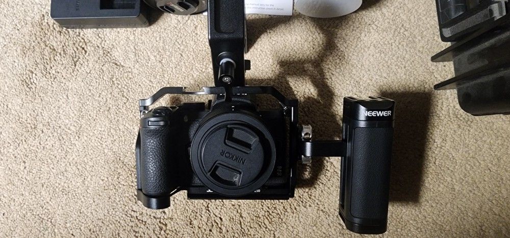 Nikon Z50 Camera Body With Cage 3 Lenses 2 Batteries Charger SD Card And Hard Case