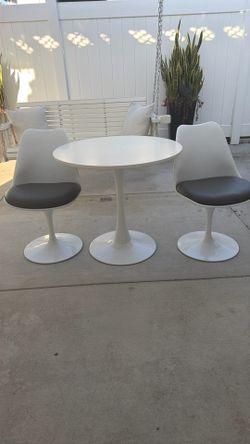 mid-century tulip table with two chairs
