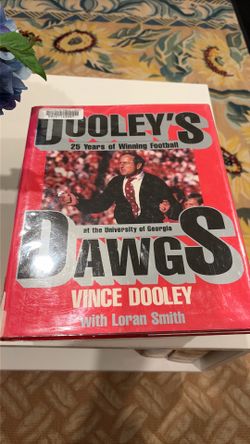 Vintage hand signed This Vince Dooley: 25 Years of Winning Football hardcover book features a bright red dust jacket with a prominent photo of the coa