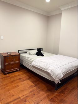 Full size bed and mattress and wooden two drawer night stand